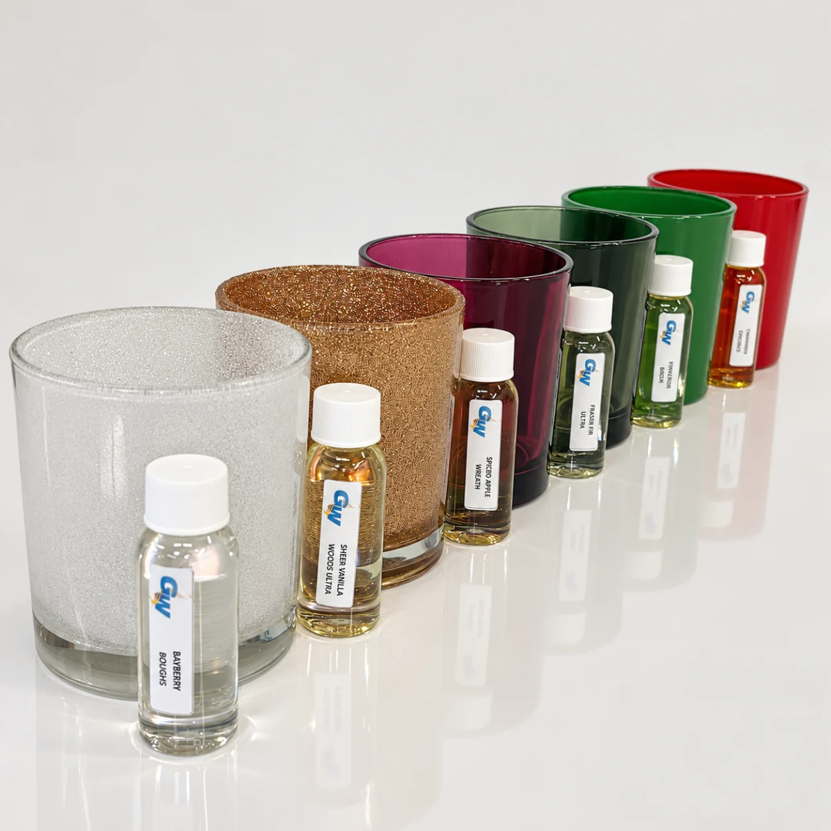 Christmas ’95 fragrance oils paired with red, green, gold and white Havana candle jars