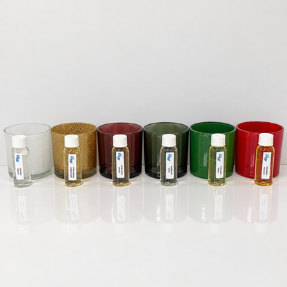 Christmas ’95 fragrance oils arranged with six colorful Monticiano candle jars