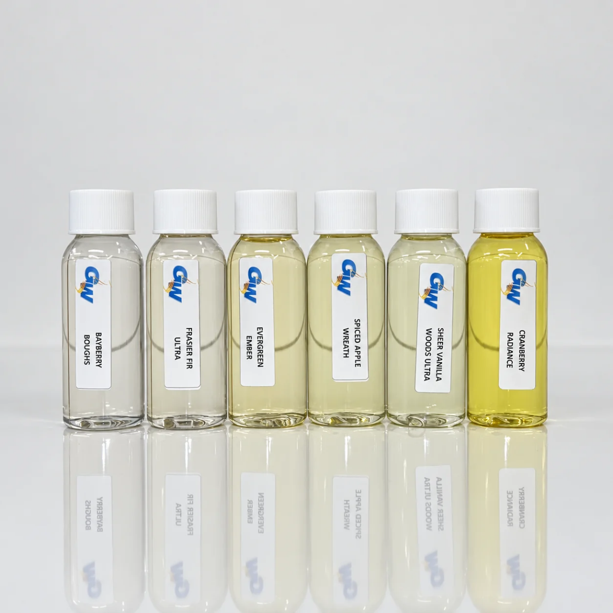 Six Christmas ’95 holiday candle fragrance oil bottles