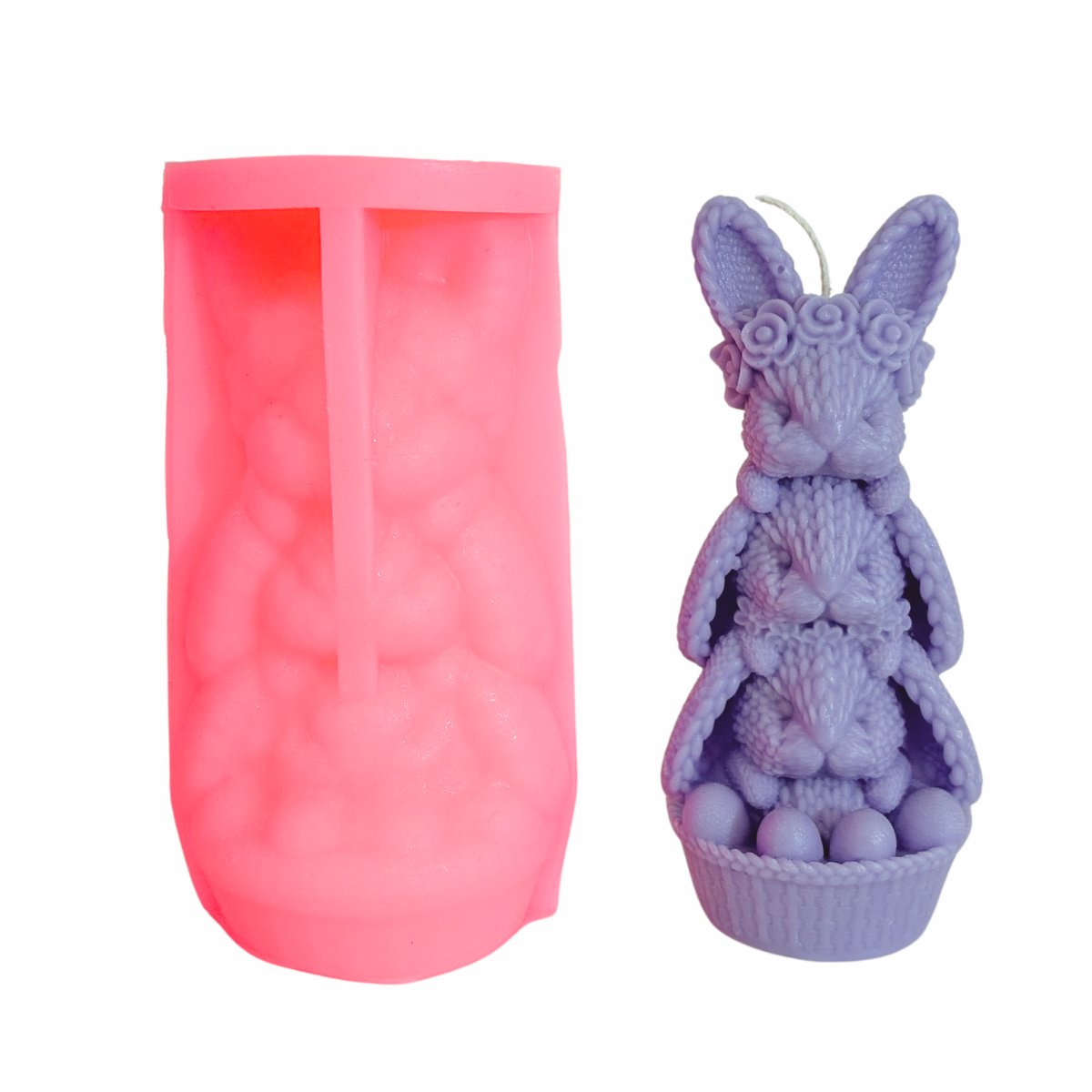 A pink silicone mold shown next to a lavender-colored bunny-shaped candle with a wick