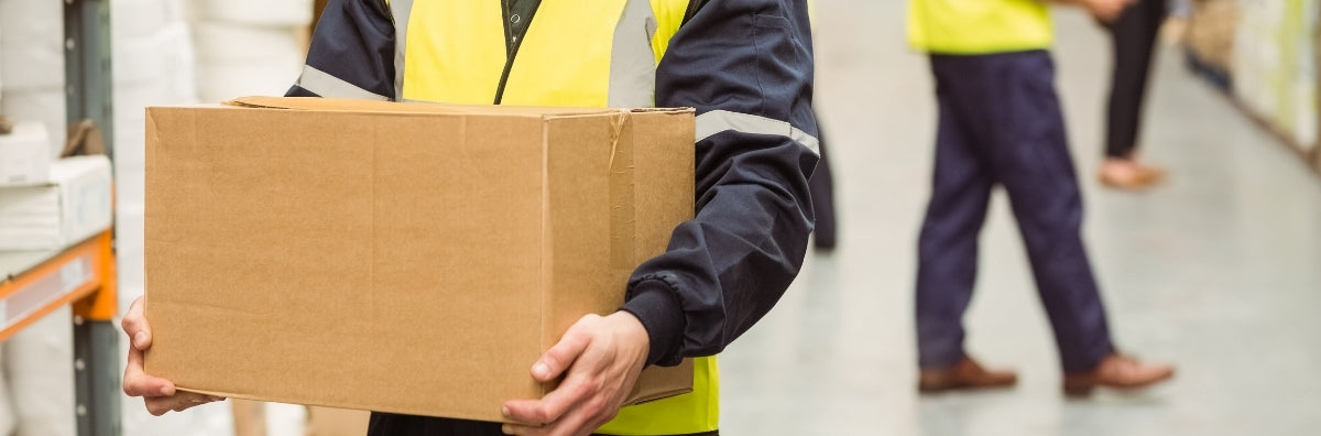 a person holding a cardboard box